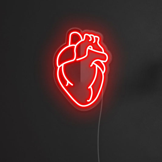 A red neon sign displaying the heart shape in red color.